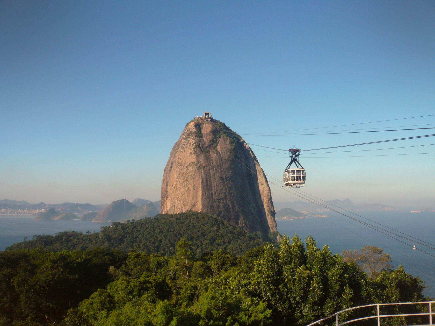 The cable car climbing to Sugarloaf Mountain over Guanabara Bay