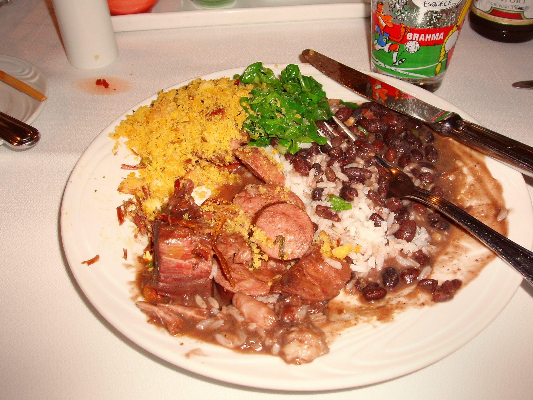 A plate of feijoada, the Brazilian black bean and pork stew