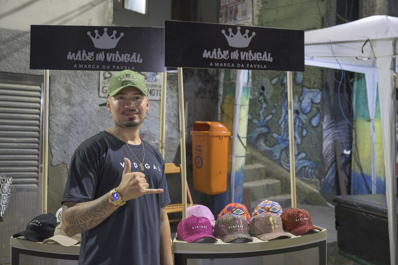 A stall selling Made in Vidigal caps